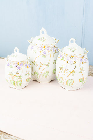 https://poshchicago.com/cdn/shop/products/AntiqueFrenchPorcelainCanisterTrio-1_large.jpg?v=1692742049