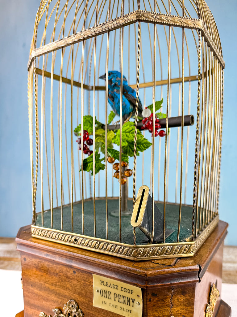 Antique singing bird automaton reference image — P.O.S.H. An antique mechanical singing bird automaton shown as a reference example; this is not identified as Molly from Art of Play